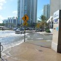 Sunny day flooding in Brickell, Miami during king tides in Oct., 2016