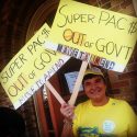 Woman protesting for campaign finance reform and against super PACs