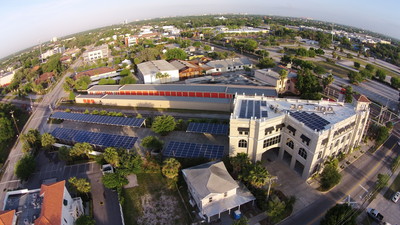Large_first_housing_hq__35kw_integ._tpo_roof__led_lts.__100kw_solar_car_ports__took_to_zero_energy
