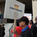 Save Our Custodians sign.