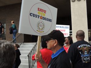 Save Our Custodians sign.